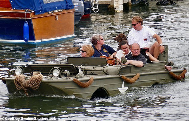 I have a feeling we shouldn’t be here. Vintage amphibious vehicles cruise the Thames for the annual Traditional Boat Festival